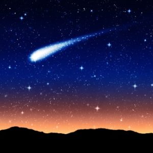 starry sky at night with comet or shooting star